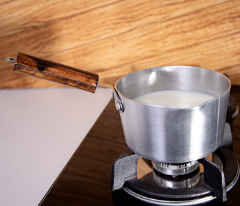Royalford RF8992 7-inches Aluminium Milk Pan With Wooden Handle - Silver in UAE